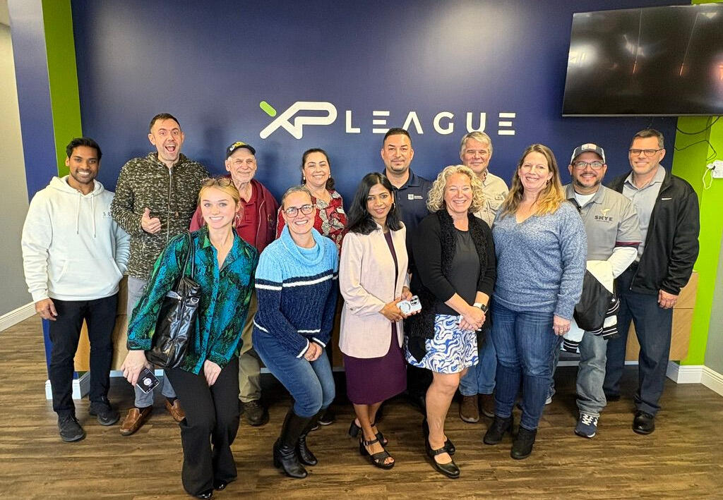 In person networking at XP League Group of people networking at XP League Clearwater